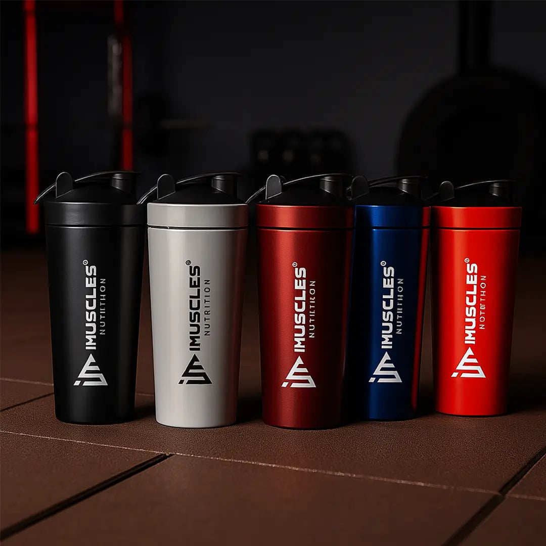 A detailed product infographic for the iMuscles Nutrition stainless steel shaker, referenced as black 4.jpg. The left side highlights key features such as being odor-free, easy to clean, recyclable, leak-proof, freezer safe, and made of stainless steel, with a central note that the logo is "ENGRAVED NOT PRINTED". The right side features an exploded view of the 739ml jar, showing the leak-proof lid, leak-proof cap, and the included whisk ball.