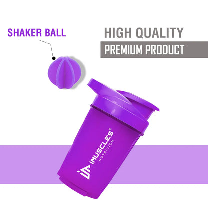 A promotional banner for the iMuscles Nutrition green shaker bottle. On the left, bold dark green text on a light green background reads "SHAKE UP SUCCEED" and "YOUR FITNESS GAME CHANGER". The right side features a 500 ml lime green shaker bottle and a matching green mixing ball, labeled with "VERSATILITY" and "500 ML
