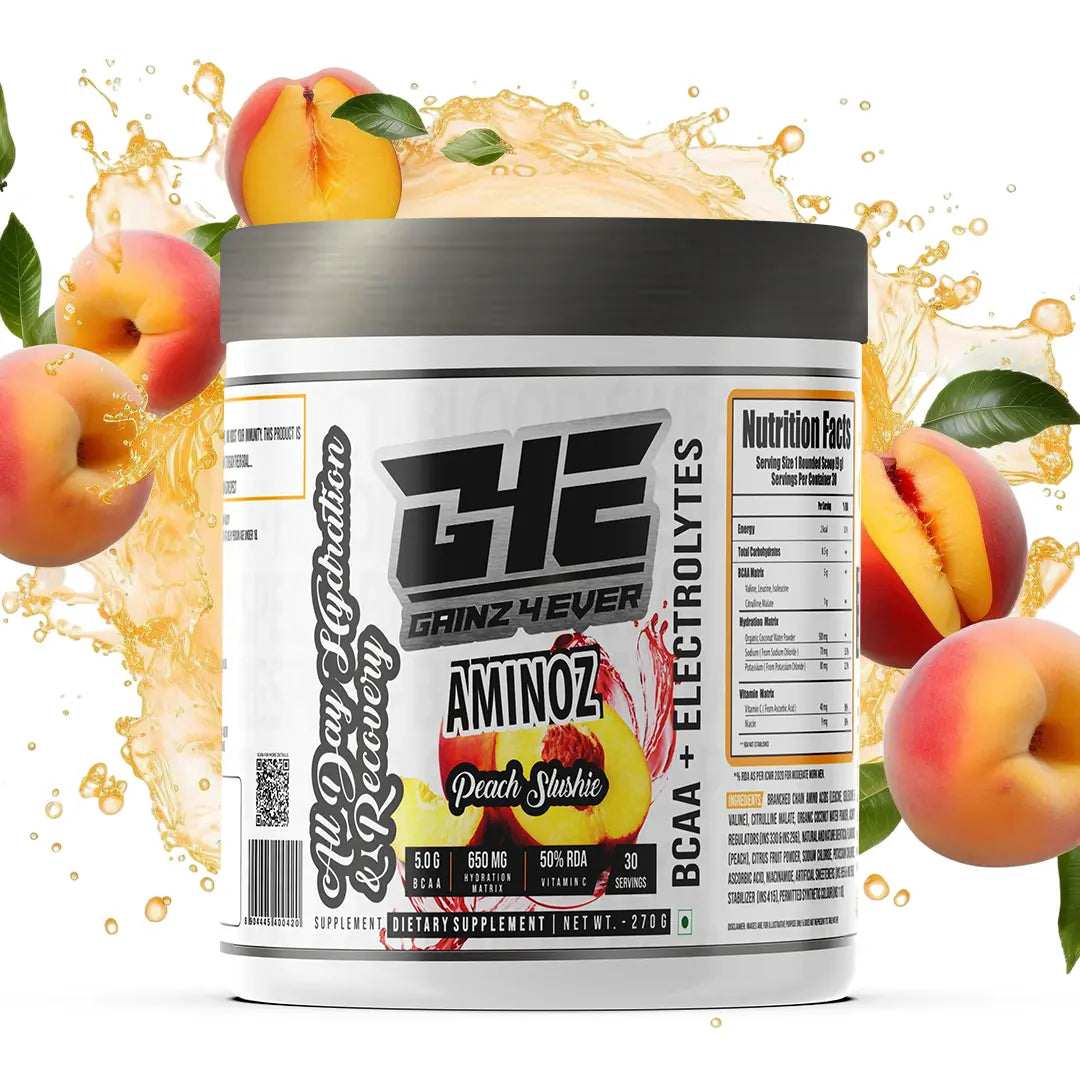 Promotional graphic for GAINZ 4 EVER AMINOZ Peach Slushie flavor. The white 270g supplement jar is centered against a background of dynamic yellow and orange liquid splashes and fresh peach slices with green leaves. The label prominently features "BCAA + ELECTROLYTES" and "All Day Hydration & Recovery" with callouts for 5.0g BCAA, 650mg Hydration Matrix, and 50% RDA Vitamin C.
