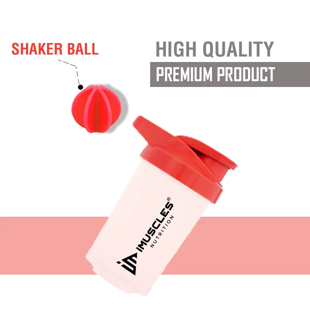 A promotional banner for the iMuscles Nutrition red and white shaker bottle titled red & white 1.png. On the left side, bold dark red text on a light pink background reads "SHAKE UP SUCCEED" and "YOUR FITNESS GAME CHANGER". The right side features a 500 ml shaker bottle with a white body and red lid alongside a matching red mixing ball, labeled with "VERSATILITY" and "500 ML".