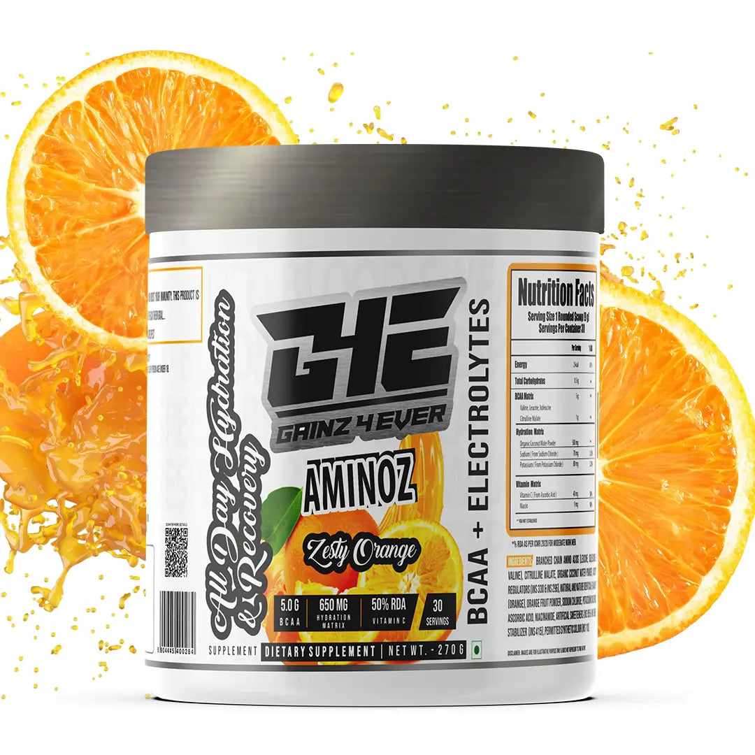 Promotional graphic for GAINZ 4 EVER AMINOZ Zesty Orange flavor. The white 270g supplement jar is centered against a background of dynamic orange liquid splashes and fresh orange slices. The label highlights "BCAA + ELECTROLYTES" and "All Day Hydration & Recovery" with callouts for 5.0g BCAA, 650mg Hydration Matrix, and 50% RDA Vitamin C.