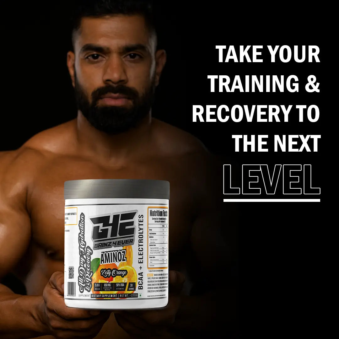 Promotional graphic for GAINZ 4 EVER AMINOZ Zesty Orange flavor. The white 270g supplement jar is centered against a background of dynamic orange liquid splashes and fresh orange slices. The label highlights "BCAA + ELECTROLYTES" and "All Day Hydration & Recovery" with callouts for 5.0g BCAA, 650mg Hydration Matrix, and 50% RDA Vitamin C.