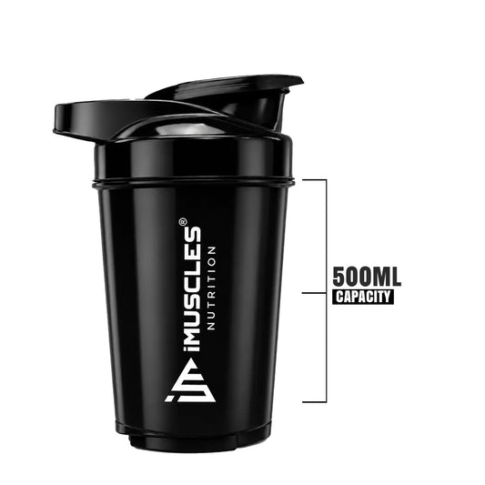 A promotional banner for the iMuscles Nutrition black shaker bottle titled black 1.png. On the left side, bold dark gray text on a light gray background reads "SHAKE UP SUCCEED" and "YOUR FITNESS GAME CHANGER". The right side features a 500 ml sleek black shaker bottle and a matching black mixing ball, labeled with "VERSATILITY" and "500 ML
