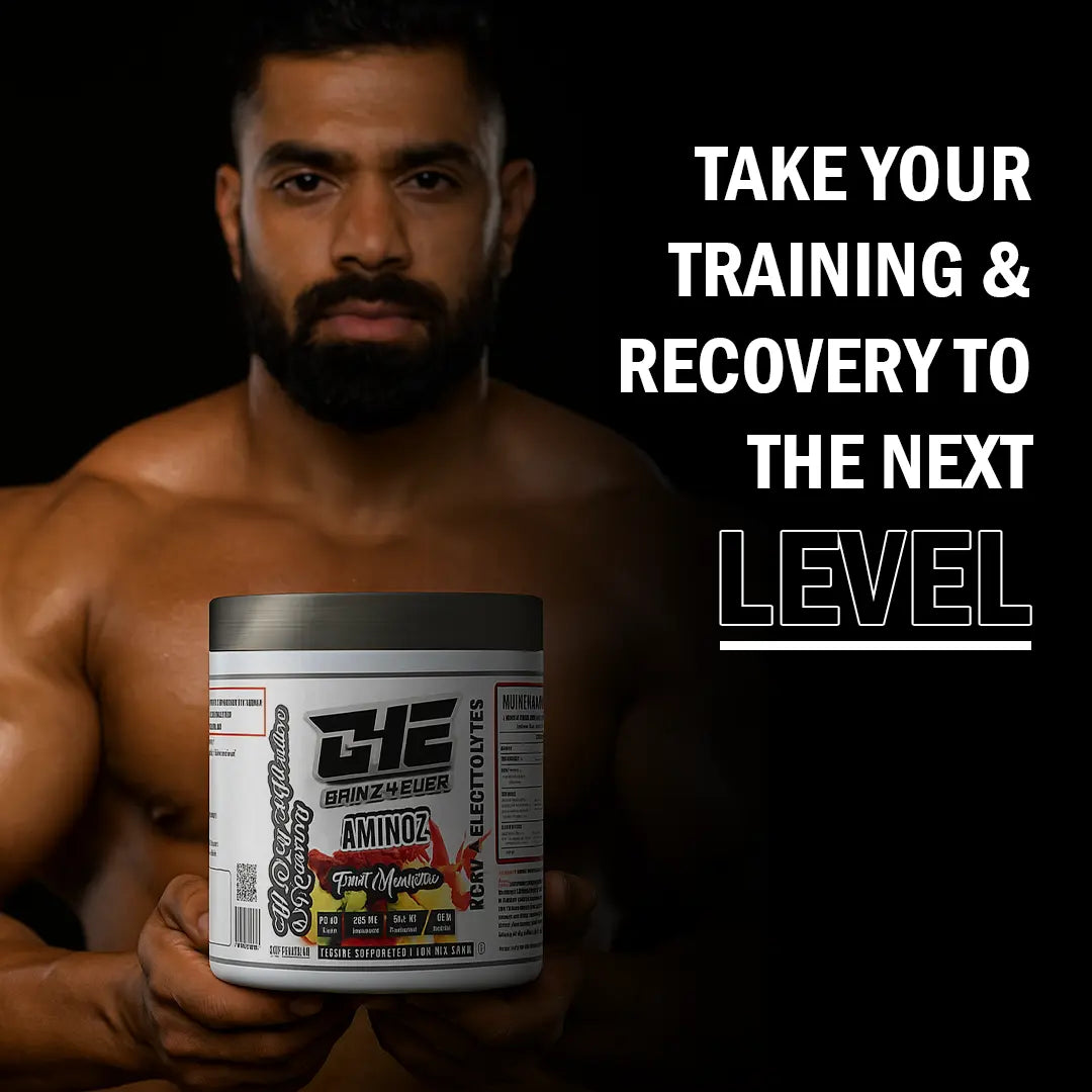 Promotional image for GAINZ 4 EVER AMINOZ Fruit Manhattan flavor. The white 270g supplement jar is positioned in the center, surrounded by vibrant splashes of red and orange liquid, fresh raspberries, blueberries, grapefruit slices, and grapes. The label highlights "BCAA + ELECTROLYTES" and "All Day Hydration & Recovery" with 30 servings per container.