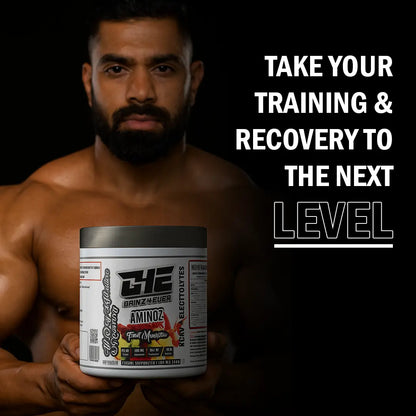 Promotional image for GAINZ 4 EVER AMINOZ Fruit Manhattan flavor. The white 270g supplement jar is positioned in the center, surrounded by vibrant splashes of red and orange liquid, fresh raspberries, blueberries, grapefruit slices, and grapes. The label highlights "BCAA + ELECTROLYTES" and "All Day Hydration & Recovery" with 30 servings per container.